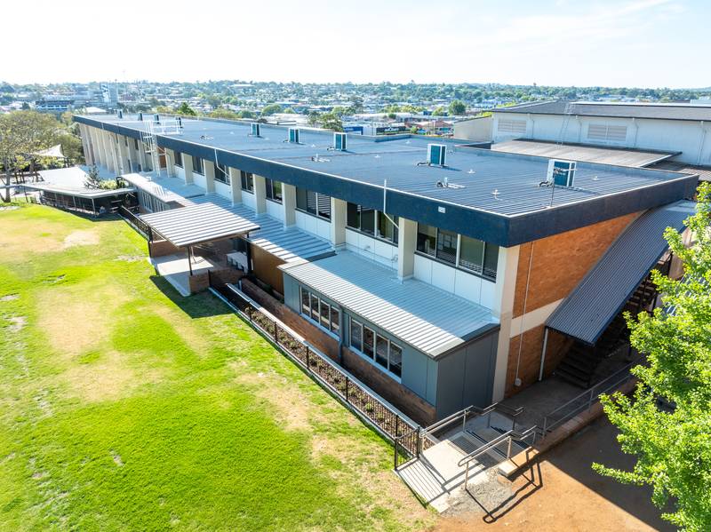 side view of St Saviour School with inverter ac on roof
